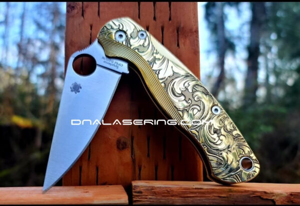 il_fullxfull.3680570570_ix7w.jpg Leaf Scroll - Spyderco PM2 Lotus - NEW Relief Engraving Style - Deep Laser Engraved - Brass Knife Scales -Flytanium *Knife Install Optional*