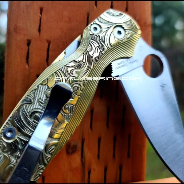 il_fullxfull.3680570982_6jfs.jpg Leaf Scroll - Spyderco PM2 Lotus - NEW Relief Engraving Style - Deep Laser Engraved - Brass Knife Scales -Flytanium *Knife Install Optional*