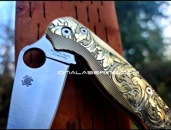 il_fullxfull.3728171155_cf2q.jpg Leaf Scroll - Spyderco PM2 Lotus - NEW Relief Engraving Style - Deep Laser Engraved - Brass Knife Scales -Flytanium *Knife Install Optional*