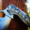 il_fullxfull.3879352570_nn75.jpg Leaf Scroll - Spyderco PM2 Lotus TI - NEW Relief Engraving - Deep Laser Engraved - Titanium Scales - Flytanium Gear *Knife Install Optional*
