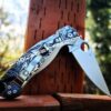 il_fullxfull.3926840043_rekp.jpg Leaf Scroll - Spyderco PM2 Lotus TI - NEW Relief Engraving - Deep Laser Engraved - Titanium Scales - Flytanium Gear *Knife Install Optional*