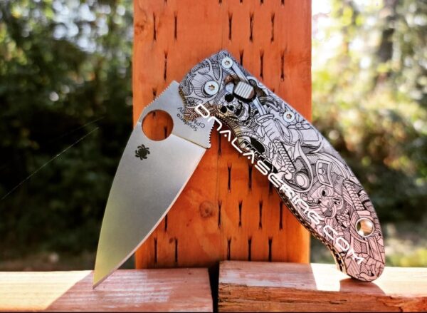 il_fullxfull.4253128484_bsjb.jpg Japanese Warrior - Samurai Skulls - Spyderco Manix 2 - Deep Laser Engraved Titanium Scales - Flytanium Gear *Knife Install Optional*