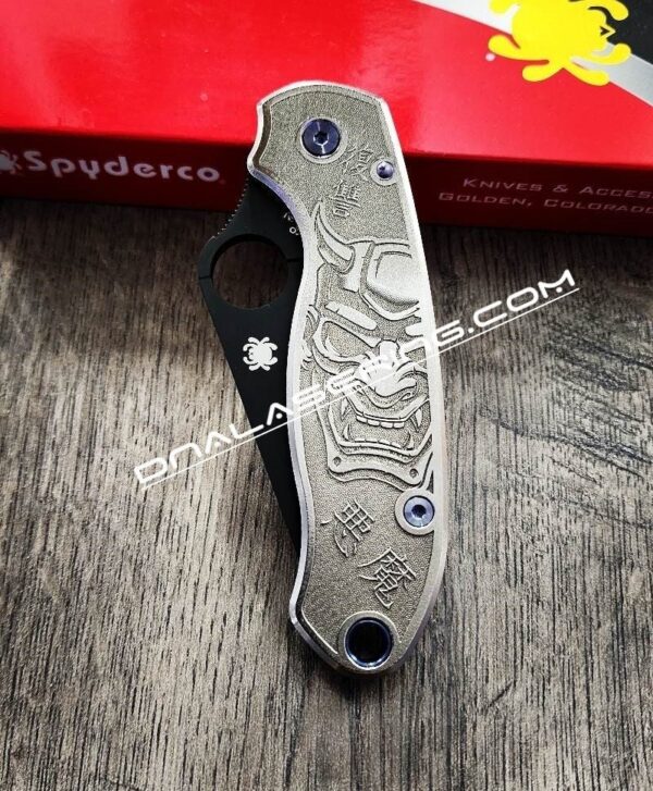 il_fullxfull.4673257421_896f-1.jpg Japanese Devil Mask - Spyderco PM3 TI - NEW Relief Engraving Style - Laser Engraved - Titanium Scales - EDC Gear - Knife Install Optional