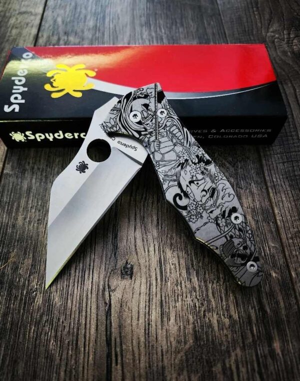 il_fullxfull.5155966510_lbeu.jpg Japanese Samurai Design - Spyderco Yojimbo 2 - Deep Laser Engraved - Stonewash Titanium Scales - EDC Gear - Fully Installed Knife Option