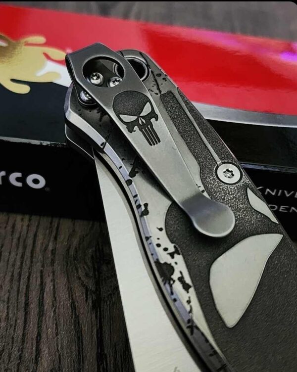 il_fullxfull.6144961125_kc7e.jpg Spyderco PM2 relief engraved titanium Punisher Skull Scales with matching relief engraved LynchNW deep carry pocket clip - Titanium hardware