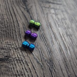 il_fullxfull.7094586385_dtht.jpg Titanium Thumbstud Kit for Benchmade Knives - Anodized - 3 Colors - Green - Purple - Teal - Bugout - 940 - 945 - Griptilian - Flytanium Gear
