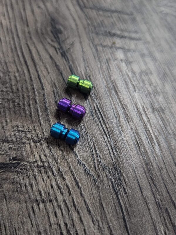 il_fullxfull.7094586385_dtht.jpg Titanium Thumbstud Kit for Benchmade Knives - Anodized - 3 Colors - Green - Purple - Teal - Bugout - 940 - 945 - Griptilian - Flytanium Gear