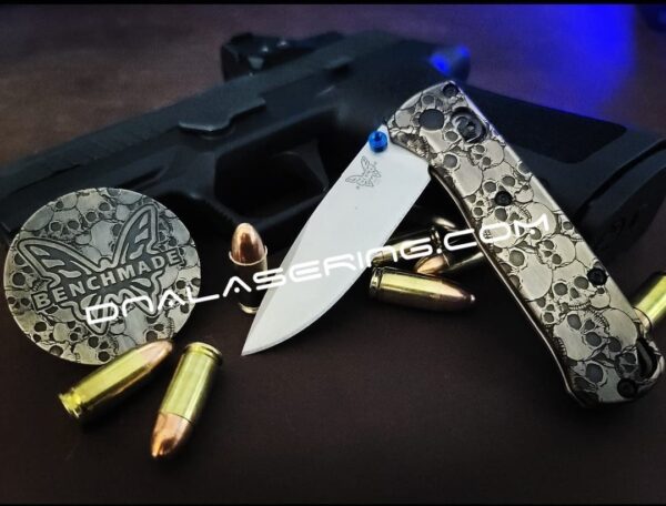 il_fullxfull.3892157846_ibhc.jpg Skulls - Aged Finish - MINI Benchmade Bugout Brass - Relief Engraved Brass Scales - Flytanium Gear *Scales/Handles Only* Optional Coin