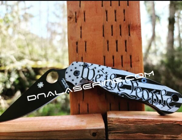 il_fullxfull.3910872257_p8m9.jpg We the People - US Flag - Spyderco PM2 - Deep Laser Engraved - PM2 Titanium Knife Scales - Flytanium Gear - Knife & Hardware Optional