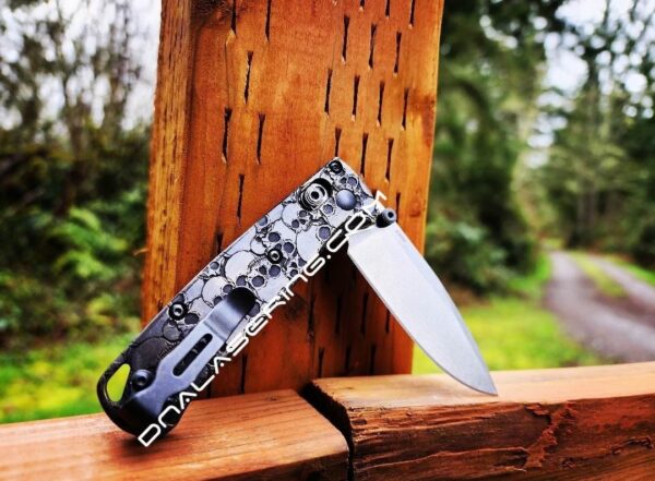 il_fullxfull.4846262377_pubi.jpg Skulls - Aged Finish - MINI Benchmade Bugout Brass - Relief Engraved Brass Scales - Flytanium Gear *Scales/Handles Only* Optional Coin