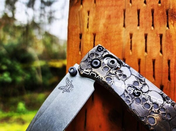 il_fullxfull.4846262389_64bi.jpg Skulls - Aged Finish - MINI Benchmade Bugout Brass - Relief Engraved Brass Scales - Flytanium Gear *Scales/Handles Only* Optional Coin
