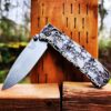 il_fullxfull.4846262395_tibb.jpg Skulls - Aged Finish - MINI Benchmade Bugout Brass - Relief Engraved Brass Scales - Flytanium Gear *Scales/Handles Only* Optional Coin