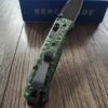 il_fullxfull.5673024026_icvn.jpg Benchmade Bugout Electric Green Carbon Fiber Scales - No Lanyard - Deep Chamfer