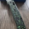 il_fullxfull.5673024646_qbzo.jpg Benchmade Bugout Electric Green Carbon Fiber Scales - No Lanyard - Deep Chamfer