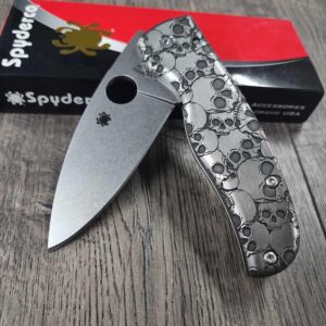 il_fullxfull.6375729606_2v1x.jpg Spyderco Shaman - Skulls Pattern - Relief Laser Engraved - Titanium scales - Complete Knife - LynchNW Clip - Phosphor Washers