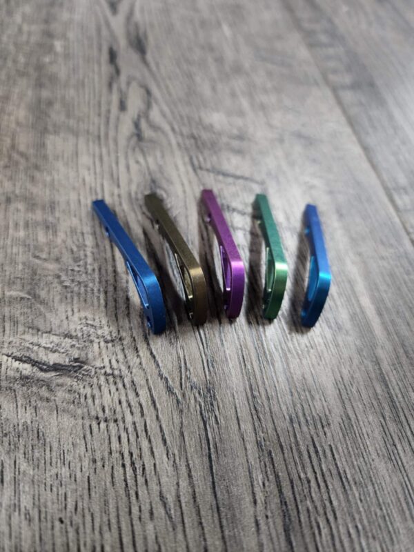 il_fullxfull.6733745863_nsvt.jpg Benchmade Bugout 535 - Anodized Titanium Backspacer - 5 Color Options - Blue - Bronze - Purple - Green - Teal - Flytanium Gear