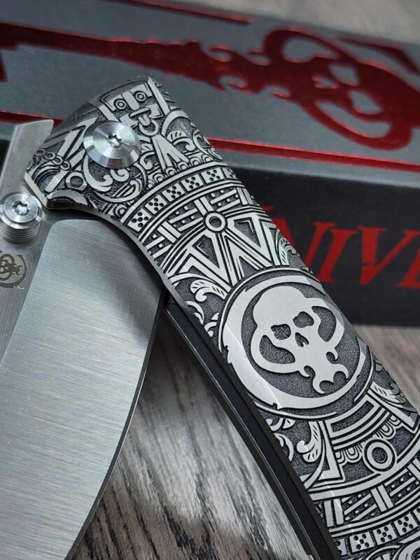 il_fullxfull.7216143190_l86h.jpg Chaves Knives - Relief Engraved RCK9 - Titanium Scales - Chaves Skull Aztec - M390 Steel - COMPLETE KNIFE!! With Extra Clip - New in Box