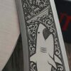 il_fullxfull.8012487706_ajno.jpg Chaves Knives - Relief Engraved RCK9 - Titanium Scales -Jaws Theme! - M390 Steel - COMPLETE KNIFE!! With Extra Clip - New in Box