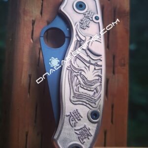 il_fullxfull.4120478110_q8fp.jpg Japanese Devil Mask - Spyderco PM3 - NEW Relief Engraving Style - Laser Engraved Copper PM3 Knife Scales - Flytanium - Knife Install Option