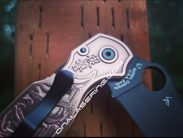 il_fullxfull.4168141511_tp3o.jpg Japanese Devil Mask - Spyderco PM3 - NEW Relief Engraving Style - Laser Engraved Copper PM3 Knife Scales - Flytanium - Knife Install Option